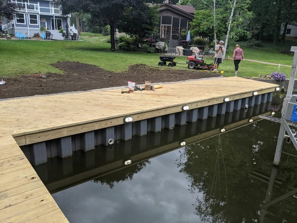 Lakeside dock with integrated deck lighting by Two Nicks Electric