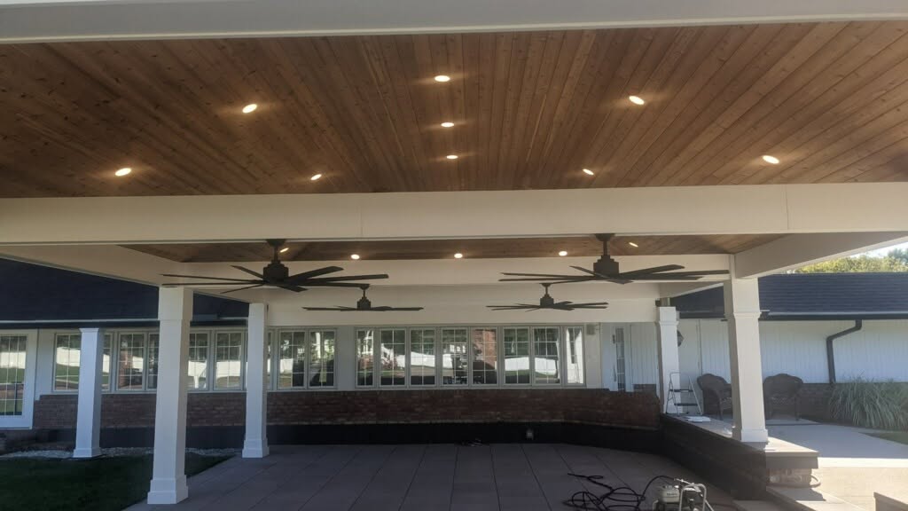 Covered patio with recessed lighting and ceiling fans installed by Two Nicks Electric